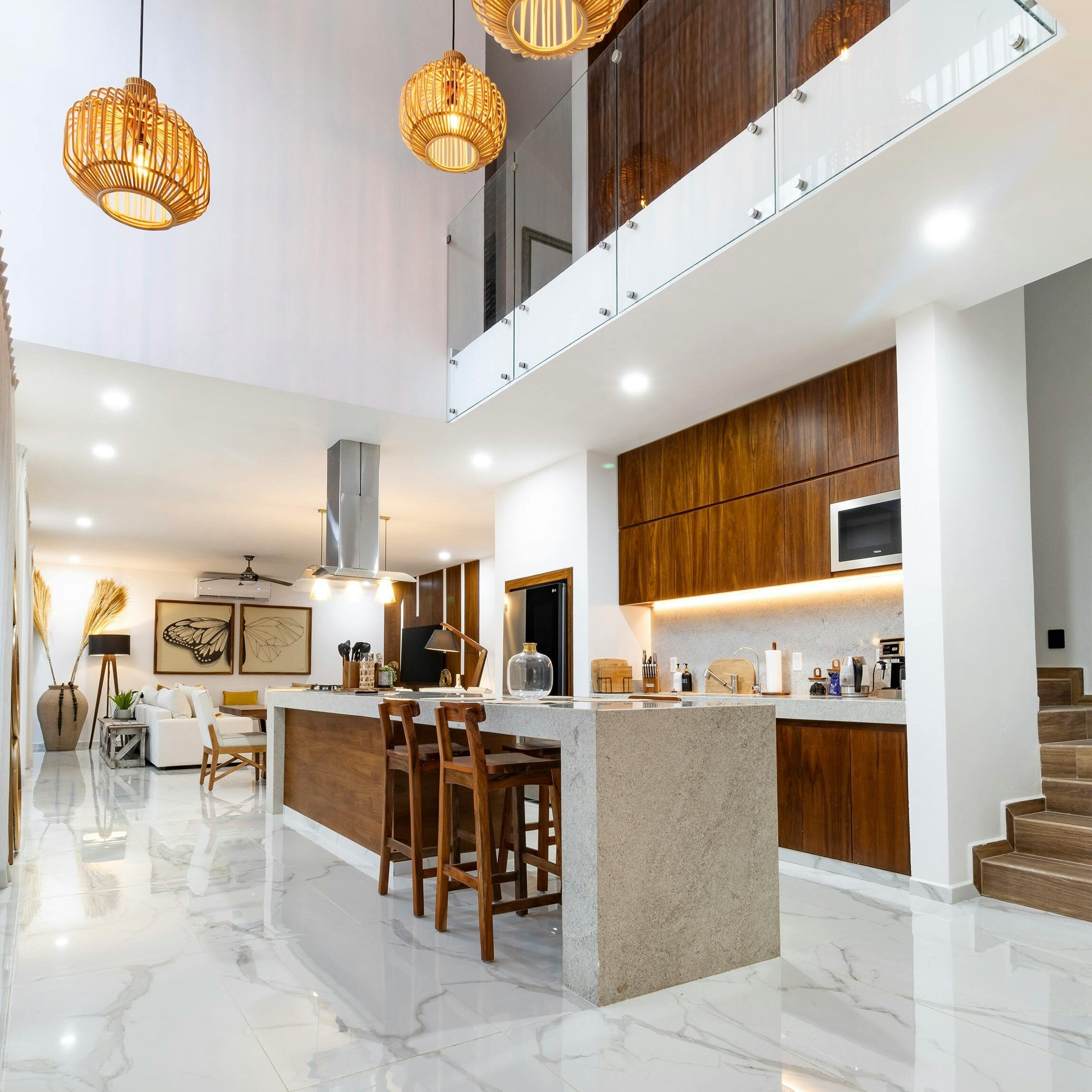 Sleek modern studio apartment with stylish kitchen and lighting.